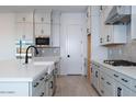 Bright kitchen with island sink, white countertop, and stainless steel appliances at 1300 E Penedes Dr, Gilbert, AZ 85298