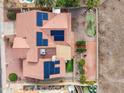 Aerial view of roof with solar panels, patio, and miniature putting green in backyard at 1017 E Grandview Rd, Phoenix, AZ 85022