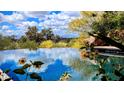 Relaxing pool with stunning views of the surrounding landscape and clear, blue skies reflected in the water at 4836 E White Gates Dr, Phoenix, AZ 85018