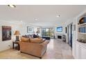 Expansive living room featuring stone floors, fireplace, and natural light from large windows at 5122 N 31St Way # 244, Phoenix, AZ 85016