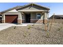 Single-story home with a tidy yard featuring decorative gravel and low-maintenance landscaping at 25975 N 160Th Ln, Surprise, AZ 85387