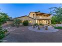 Inviting backyard featuring a fire pit and ample space for outdoor entertaining near the beautiful two-story home at 10647 N 82Nd Pl, Scottsdale, AZ 85260