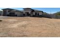 Charming single-story home featuring a modern design with a two-car garage and desert landscaping at 3295 W Mesquite St, Phoenix, AZ 85086