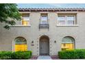 Charming two-story home with landscaped front yard and a tiled roof, with a sidewalk to front door at 955 S Henry Ln, Gilbert, AZ 85296