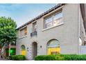 Charming two-story home with landscaped front yard and a tiled roof, with a sidewalk to front door at 955 S Henry Ln, Gilbert, AZ 85296