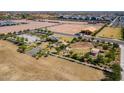 Aerial view of community amenities including playground, basketball court, and open space at 6145 S Antonio --, Mesa, AZ 85212