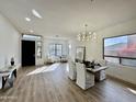 Bright and airy living room with hardwood floors and modern furniture at 10646 E Butherus Dr, Scottsdale, AZ 85255