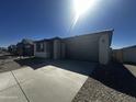 Inviting single-story home featuring a two-car garage, gravel front yard and well-kept landscaping at 4301 E Bradford Ave, San Tan Valley, AZ 85143