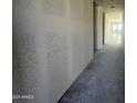 Interior hallway with textured walls and concrete floors at 4301 E Bradford Ave, San Tan Valley, AZ 85143