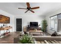 Inviting living room featuring stylish décor, modern furnishings, and wood-look floors at 3637 E Monterosa St # 17, Phoenix, AZ 85018