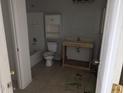 Unfinished bathroom with toilet, bathtub, and a simple vanity at 37909 W Raymond St, Tonopah, AZ 85354