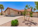 Well-manicured front yard of a charming house with a red tile roof and desert landscaping at 542 S Higley Rd # 99, Mesa, AZ 85206