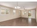 Bright, open living area with tile floors, neutral walls, and plentiful natural light at 10065 E Thatcher Ave, Mesa, AZ 85212