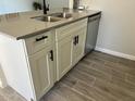 Kitchen island with double sink, dishwasher, and white shaker cabinets at 311 W Pontiac Dr # 8, Phoenix, AZ 85027