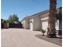 Spacious driveway with brick pavers leads to a two-car garage offering ample parking space at 18029 W San Miguel Ave, Litchfield Park, AZ 85340