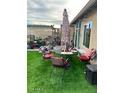 Cozy patio furniture arrangement on a grassy backyard at 6908 W Sunnyside Dr, Peoria, AZ 85345