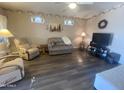 Relaxing living room featuring hardwood floors and ample seating at 1498 W Pawnee Ave, Apache Junction, AZ 85119