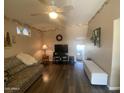 Bright living room with comfy seating and hardwood floors at 1498 W Pawnee Ave, Apache Junction, AZ 85119