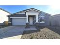 New single-story home with gray exterior and stone accents at 37907 N Cowboy Ln, San Tan Valley, AZ 85140