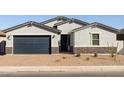 Charming single-story home featuring desert landscaping, a two-car garage, and an inviting front entrance at 4922 W Hunter Trl, San Tan Valley, AZ 85144