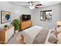 Comfortable main bedroom showcasing a soft color palette, natural light, and modern furnishings at 6556 S 258Th Dr, Buckeye, AZ 85326