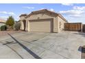 Single-story home with attached garage and well-maintained landscaping at 5535 N 103Rd Dr, Glendale, AZ 85307