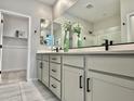 Modern bathroom with double sinks and walk-in shower at 746 E Doral Ave # 201, Gilbert, AZ 85297