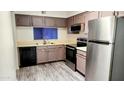 Modern kitchen with stainless steel appliances and updated cabinetry at 1319 E Marny Rd, Tempe, AZ 85288