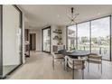 Bright dining room featuring a round table, modern lighting, and large windows at 4414 N 29Th St, Phoenix, AZ 85016