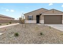 Exterior shot of a single Gathering home with low maintenance desert landscaping at 16001 W Cottontail Ln, Surprise, AZ 85387