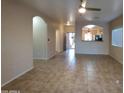 Open concept living area with tile floors and views into the kitchen at 812 W Saint Anne Ave, Phoenix, AZ 85041