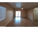 Spacious living room featuring tile flooring and sliding glass doors at 812 W Saint Anne Ave, Phoenix, AZ 85041