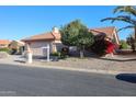 Single story home with desert landscaping and a two-car garage at 3935 N 151St Ave, Goodyear, AZ 85395