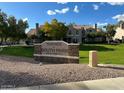 View of Townes at South Park's sign surrounded by greenery and well-maintained landscaping at 500 N Roosevelt Ave # 92, Chandler, AZ 85226