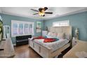 Bright bedroom boasts a king bed, shuttered windows, and neutral tones offering a serene and inviting space at 1820 N 7Th Ave, Phoenix, AZ 85007