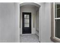 A welcoming front door with a glass insert, framed by white archways offering a glimpse inside at 3624 N 59Th St, Mesa, AZ 85215
