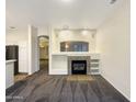 Bright living room with a fireplace and built-in shelving at 15732 E Yucca Dr, Fountain Hills, AZ 85268