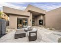 Inviting back patio with stylish outdoor seating and desert landscaping, perfect for relaxing and enjoying the outdoor space at 37200 N Cave Creek Rd # 1023, Scottsdale, AZ 85262