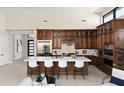 Gourmet kitchen featuring a large island, stainless steel appliances, and custom cabinetry at 14174 E Highland Ave, Fountain Hills, AZ 85268