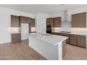 Modern kitchen featuring an island, stainless steel appliances, and sleek countertops at 28250 N 134Th Ave, Peoria, AZ 85383