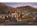 Luxury home with mountain views, featuring a large backyard and gated entry at 10739 E Diamond Rim Dr, Scottsdale, AZ 85255