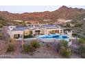 Beautiful backyard and pool area with mountain views and outdoor seating at 10739 E Diamond Rim Dr, Scottsdale, AZ 85255