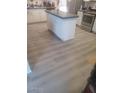 Spacious kitchen featuring an island and updated flooring at 1219 E Barcelona Ave, Casa Grande, AZ 85122