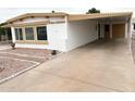 Well-maintained single-story home with convenient covered parking at 8257 E Dutchman Dr, Mesa, AZ 85208