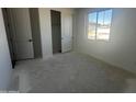 Bright, unfinished bedroom featuring a window and closet at 4317 E Bradford Ave, San Tan Valley, AZ 85143