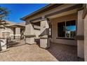 Covered patio with brick pavers and access to the backyard at 30341 N Saddlebag Ln, San Tan Valley, AZ 85143