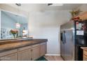 Kitchen boasts granite countertops and stainless steel refrigerator at 7777 E 2Nd St # 303, Scottsdale, AZ 85251