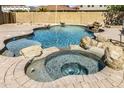 Backyard pool and spa with natural rock features at 8813 S 13Th Pl, Phoenix, AZ 85042
