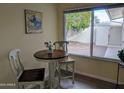 Cozy breakfast nook with table and chairs, view of backyard at 10606 W Granada Dr, Sun City, AZ 85373