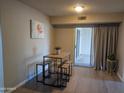 Bright dining area with small table and chairs, view to patio at 10606 W Granada Dr, Sun City, AZ 85373